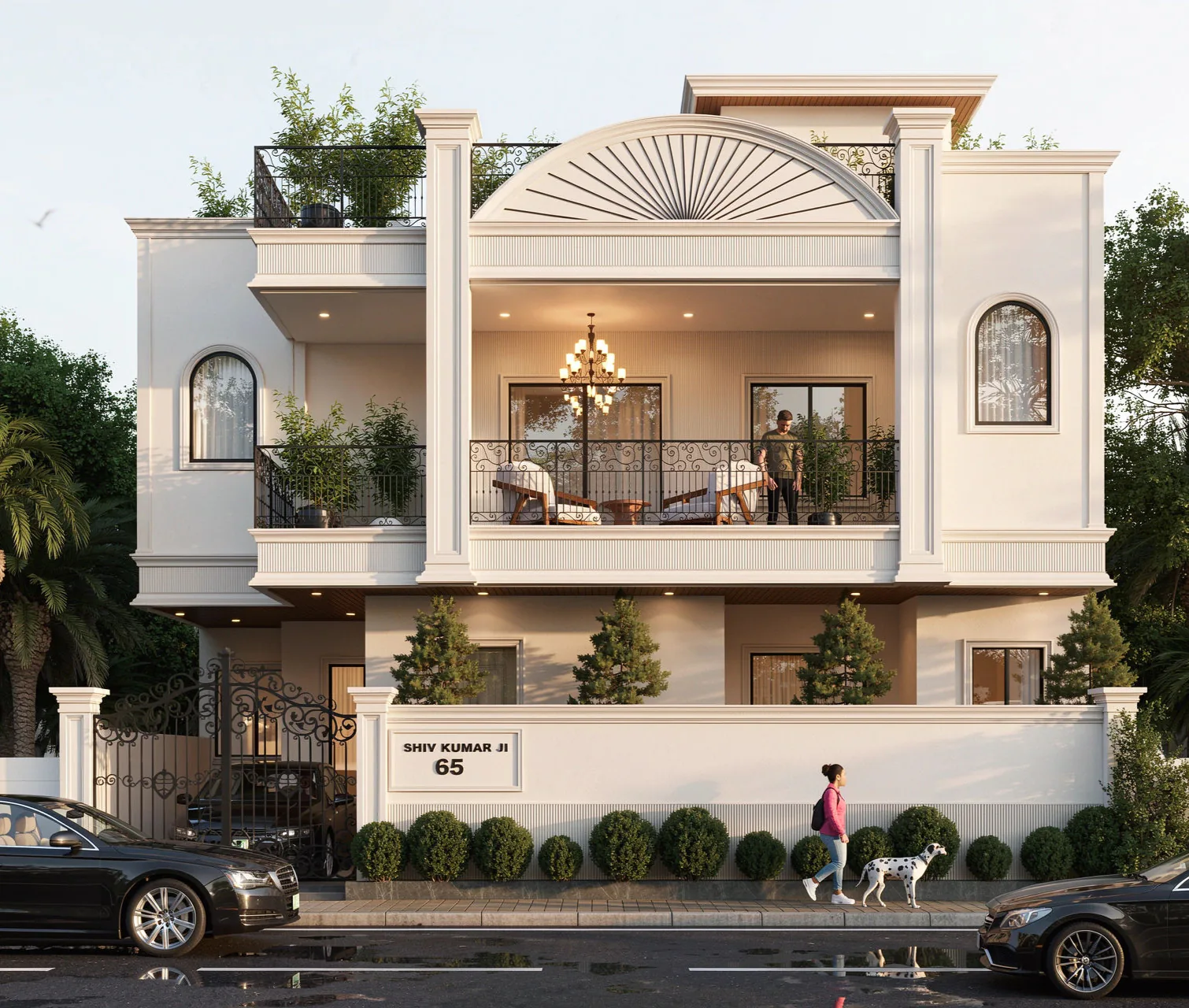 Shiv Kumar Residence front view with a sunburst pediment, chandelier-lit balcony and gated boundary wall
