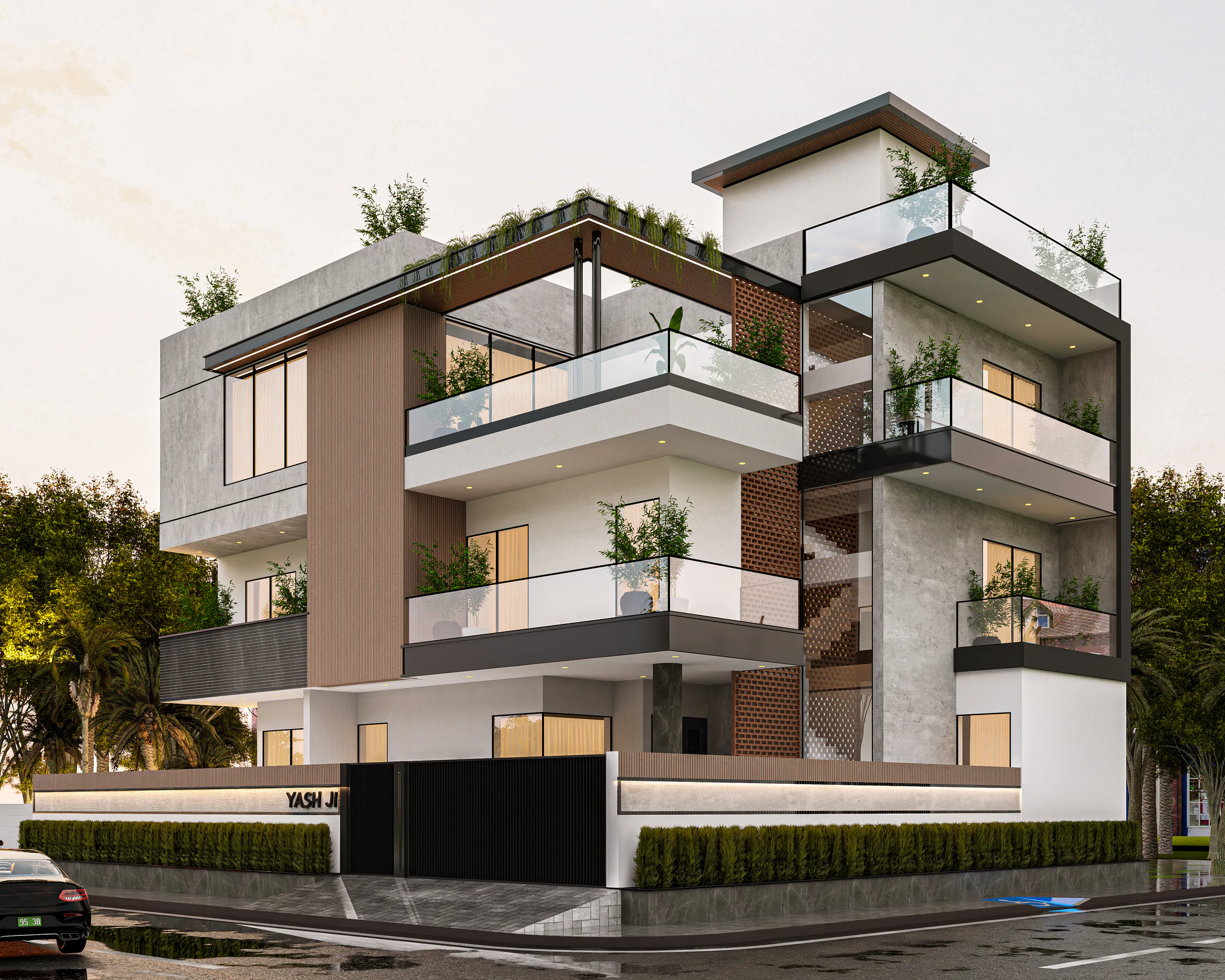 Yash Residence corner view with black-framed glass balconies and a brick jali stair screen